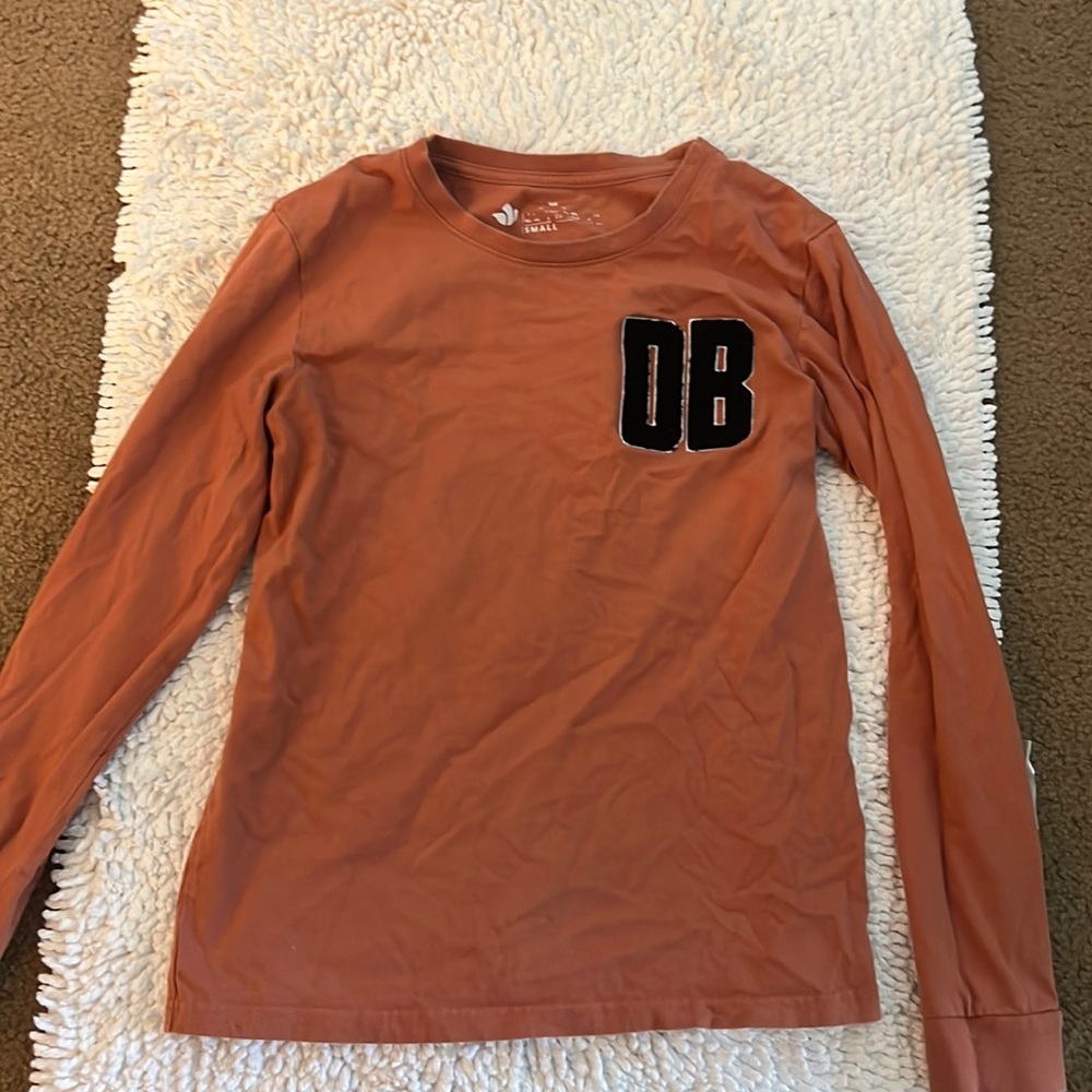 Dutch Bros burnt orange long sleeve with graphic in the back